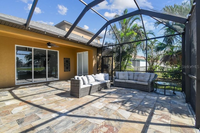 view of patio / terrace with glass enclosure, an outdoor living space, and ceiling fan