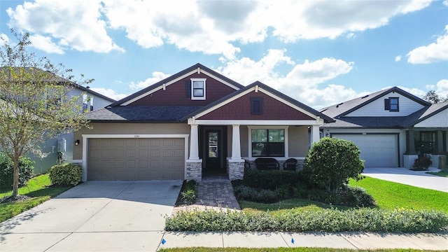 craftsman house with a garage and a porch