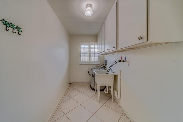 washroom featuring cabinets and light tile patterned floors