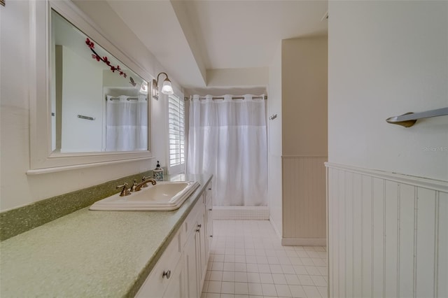 bathroom featuring a shower with curtain, tile patterned flooring, and vanity