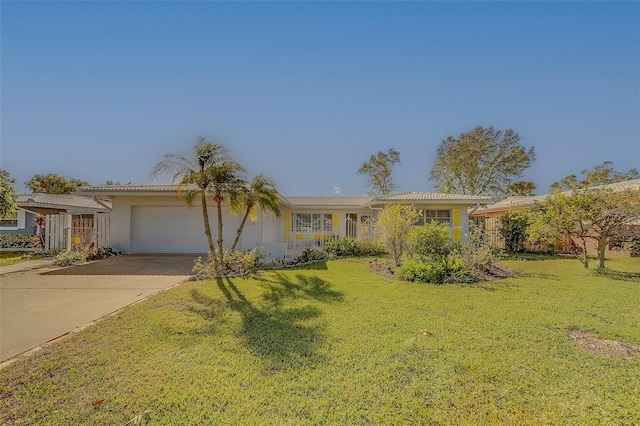 ranch-style home with a garage and a front yard