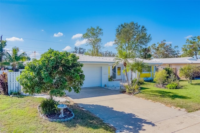 view of front of house with a garage and a front yard