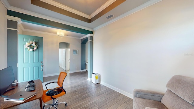 home office with a chandelier, wood-type flooring, and ornamental molding