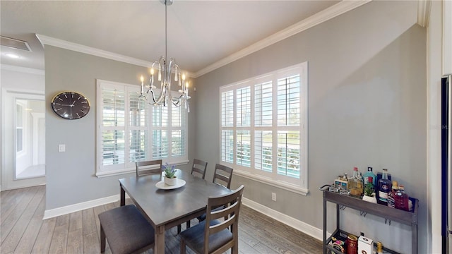 dining room with a wealth of natural light and hardwood / wood-style flooring