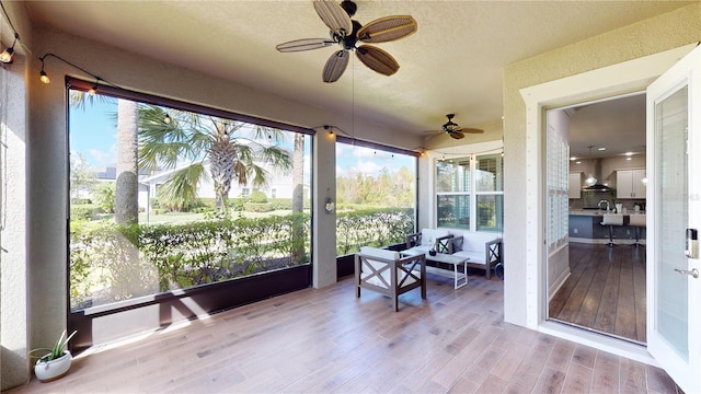 sunroom / solarium with ceiling fan