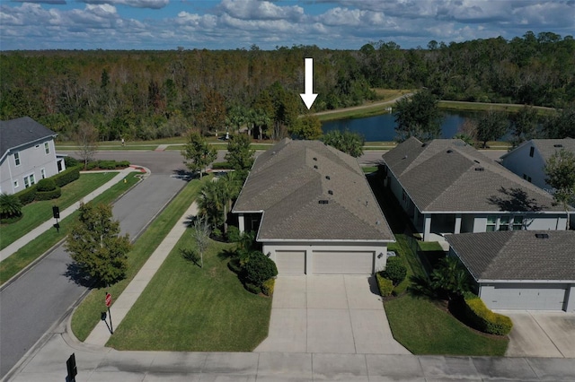 birds eye view of property featuring a water view