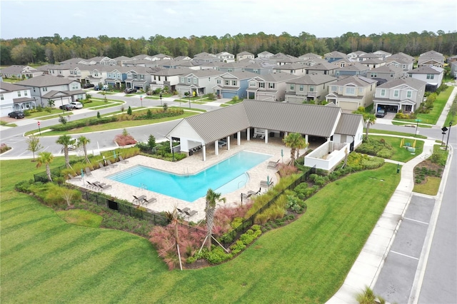 view of swimming pool with a patio and a yard