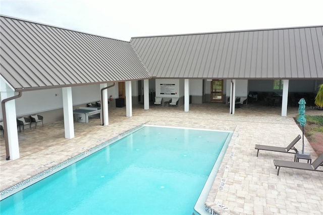 view of pool featuring a patio area