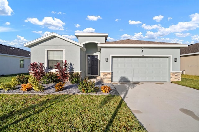 view of front facade with a front lawn and a garage