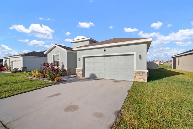 view of front of property featuring a garage and a front yard