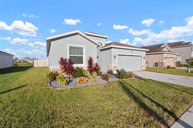 view of front of home featuring a garage and a front lawn