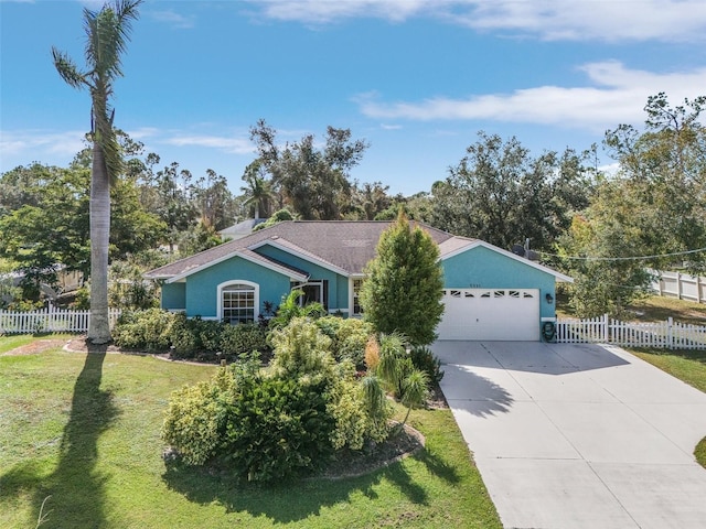 ranch-style house featuring a front lawn and a garage