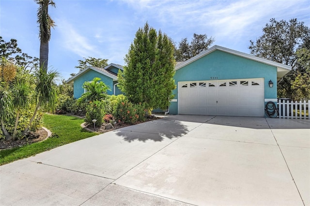 single story home with a garage