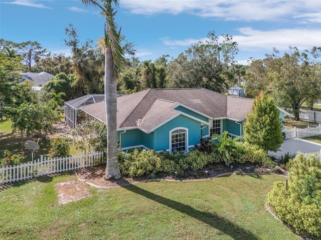 single story home featuring a front yard and a lanai