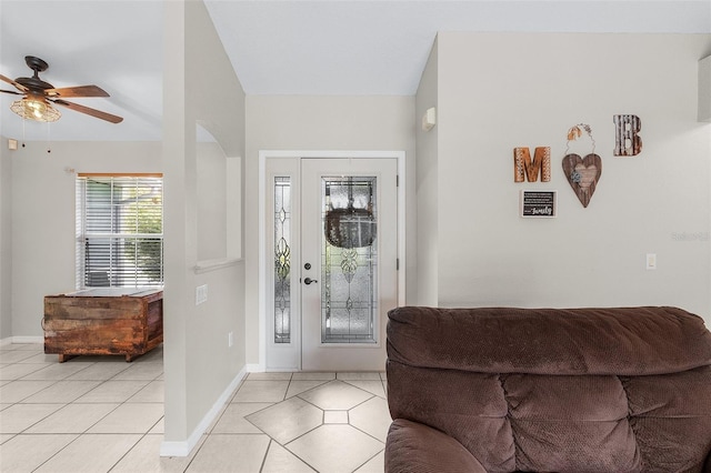 foyer with ceiling fan and light tile patterned floors