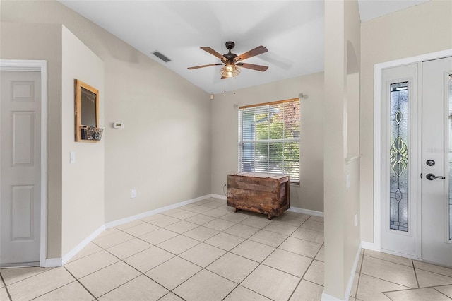 foyer entrance with light tile patterned flooring and ceiling fan