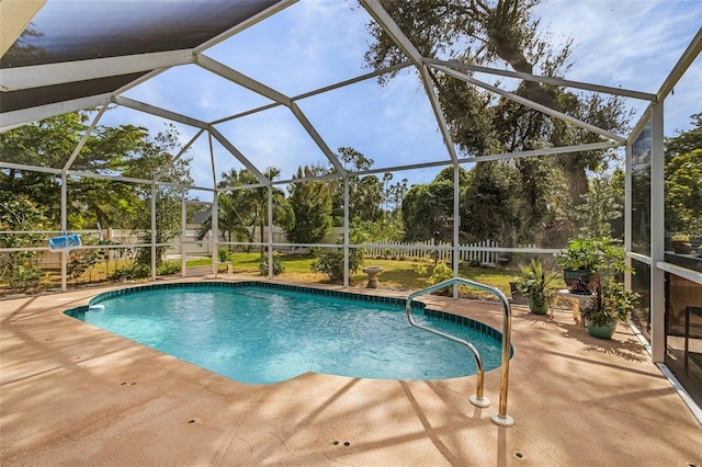 view of pool with a patio area and a lanai