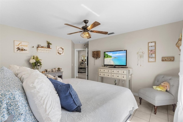 tiled bedroom featuring ceiling fan