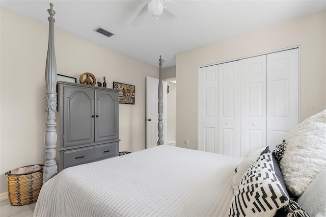 tiled bedroom featuring a closet and ceiling fan