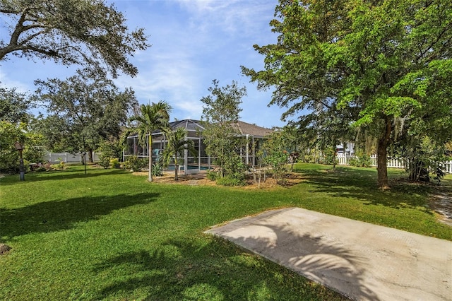 view of yard featuring a lanai