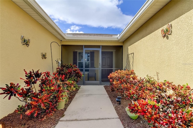 5220 Butterfly Shell Dr, Apollo Beach, FL 33572 - doorway to property with stucco siding
