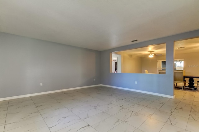 5220 Butterfly Shell Dr, Apollo Beach, FL 33572 - unfurnished room with light marble finish flooring, baseboards, and ceiling fan