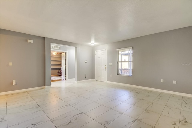 5220 Butterfly Shell Dr, Apollo Beach, FL 33572 - spare room featuring light marble finish floors and baseboards