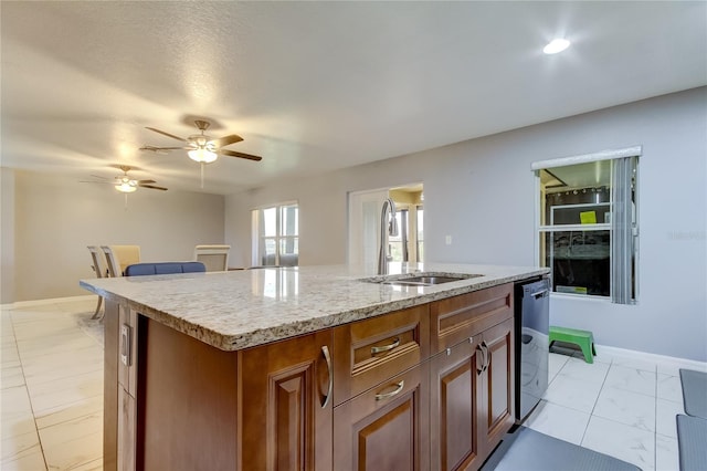 5220 Butterfly Shell Dr, Apollo Beach, FL 33572 - kitchen featuring a sink, an island with sink, dishwasher, a ceiling fan, and baseboards
