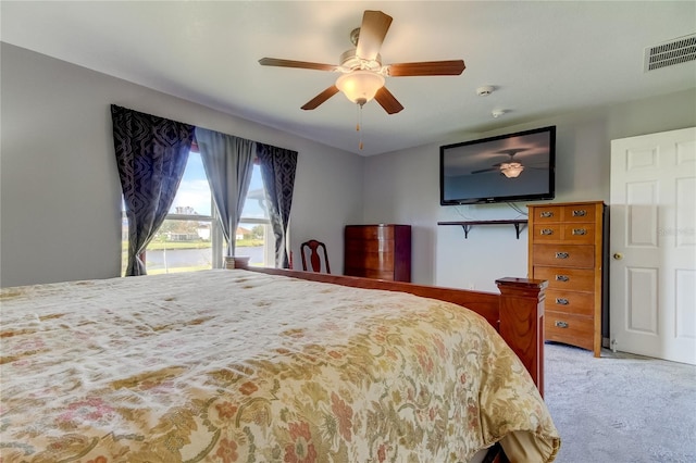 bedroom with light colored carpet and ceiling fan