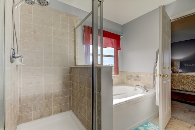 5220 Butterfly Shell Dr, Apollo Beach, FL 33572 - bathroom with connected bathroom, a garden tub, a stall shower, and tile patterned floors