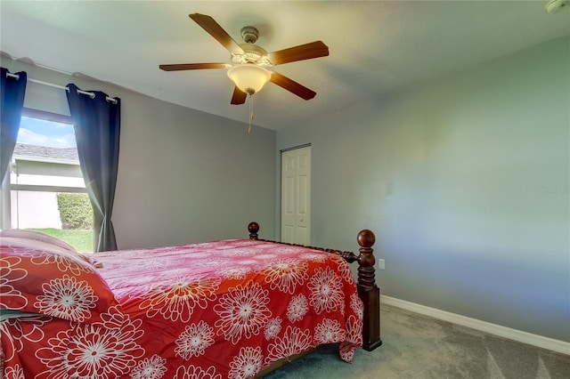 carpeted bedroom with a closet and ceiling fan