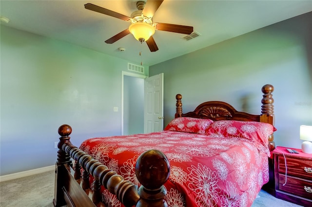 bedroom with ceiling fan and light colored carpet