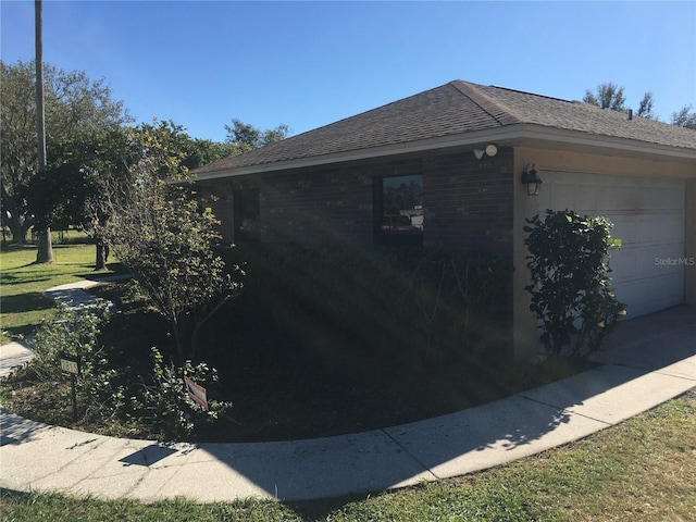 view of side of property with a garage