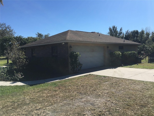 view of side of home with a garage