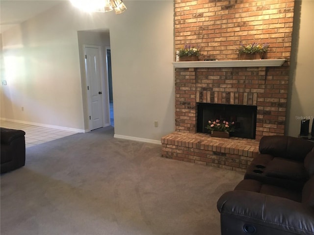 living room with a brick fireplace and carpet flooring