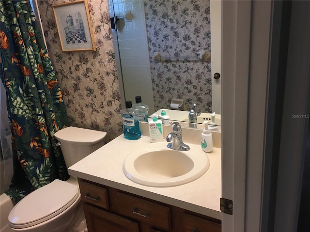 bathroom with vanity and toilet