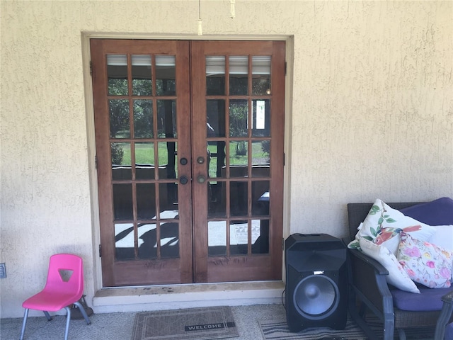 property entrance featuring french doors