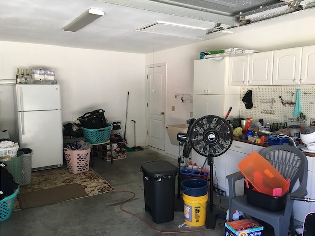 garage with white fridge