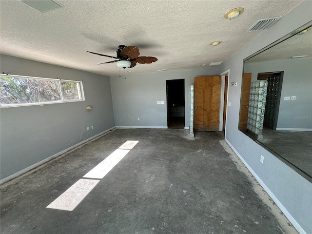 unfurnished bedroom with a textured ceiling and ceiling fan