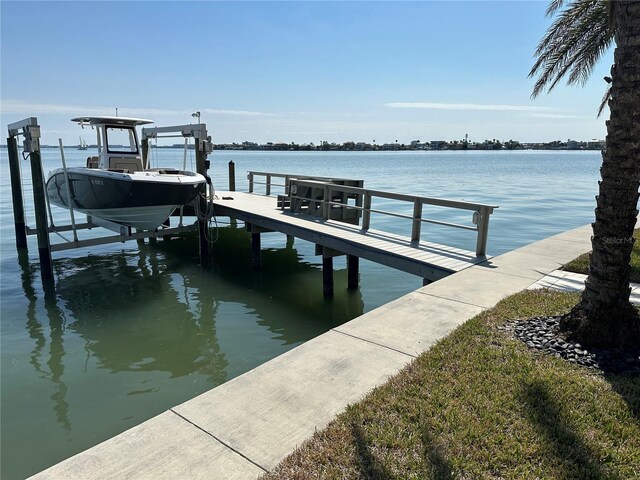 view of dock featuring a water view and boat lift