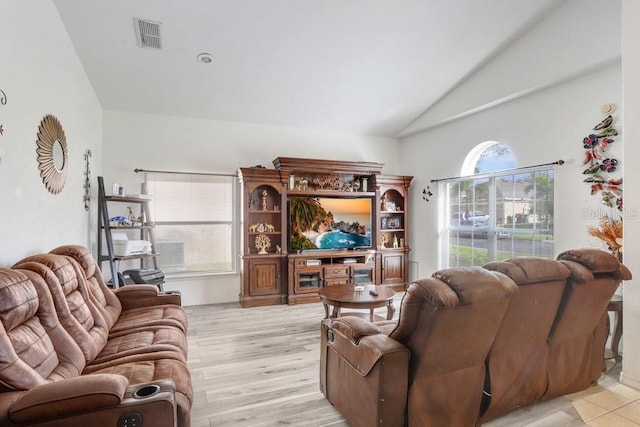 163 Andalusia Loop, Davenport, FL 33837 - living room featuring vaulted ceiling and light wood-style flooring
