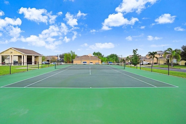 163 Andalusia Loop, Davenport, FL 33837 - view of tennis court with a residential view