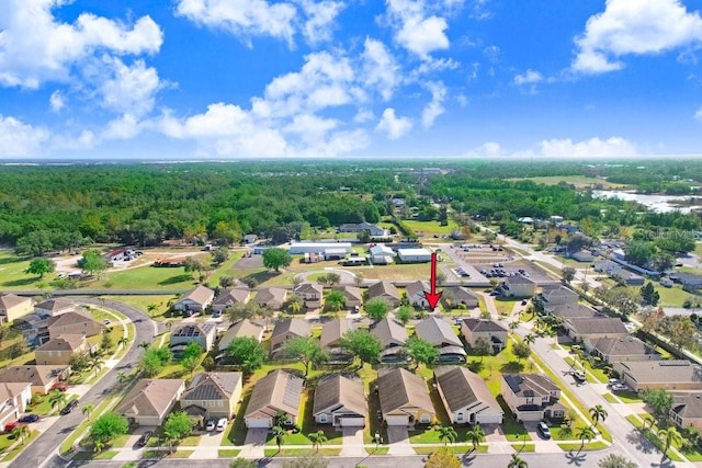163 Andalusia Loop, Davenport, FL 33837 - aerial view of property's location featuring nearby suburban area and a heavily wooded area