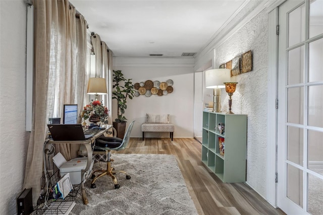 office space featuring crown molding and hardwood / wood-style flooring