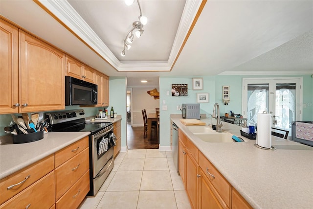 kitchen with light brown cabinetry, stainless steel appliances, crown molding, sink, and light tile patterned floors