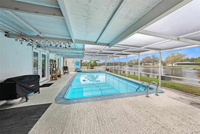 view of pool featuring glass enclosure, french doors, a grill, a water view, and a patio