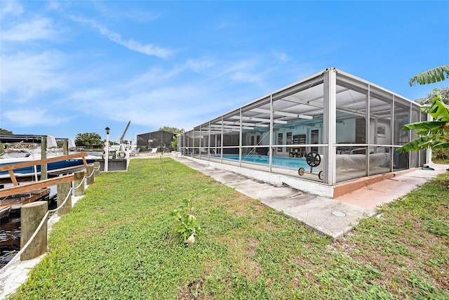 exterior space featuring a lanai and a dock