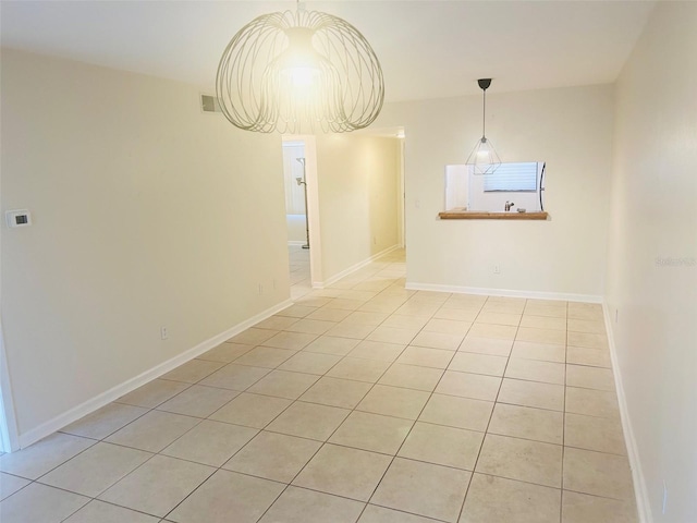 unfurnished dining area featuring light tile patterned floors