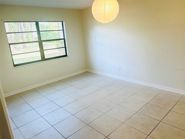 spare room featuring light tile patterned floors