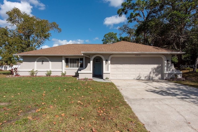 ranch-style home featuring a front lawn and a garage